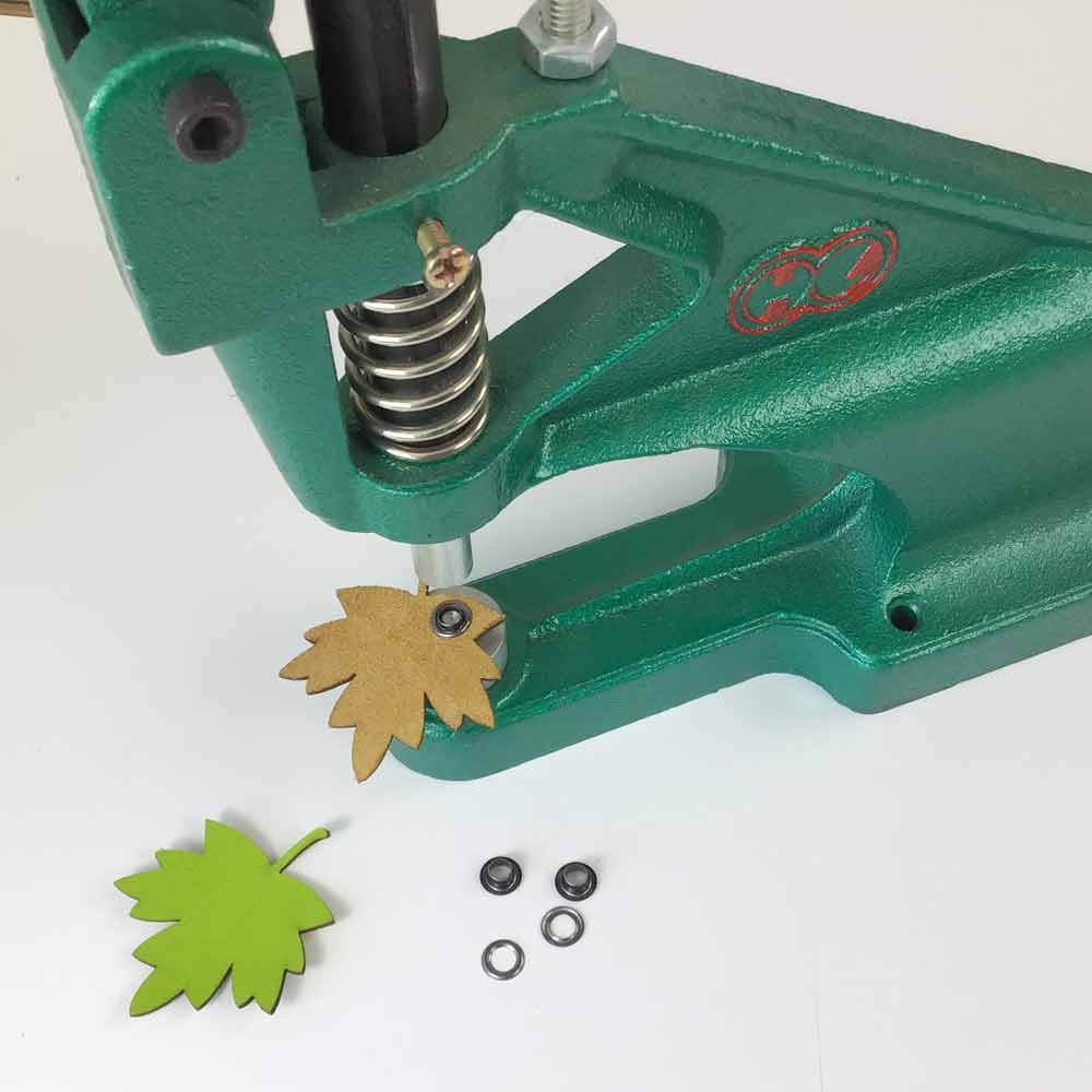 Hand press for snap fasteners, pins and metal eyelets