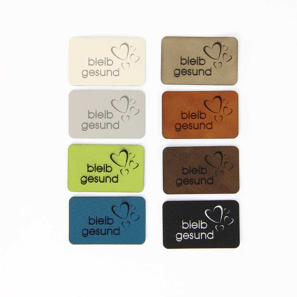 Synthetic leather labels, with the inscription "stay healthy"