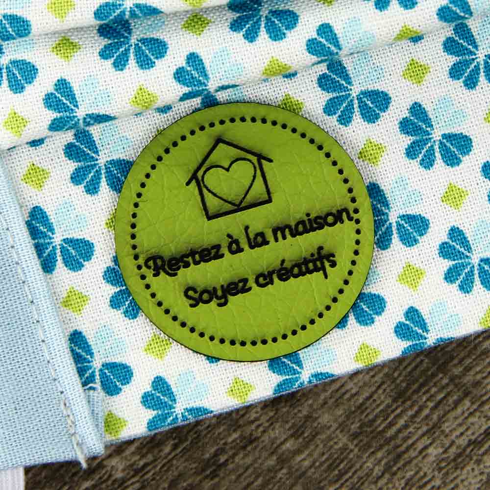 Synthetic leather labels, with the inscription "Restez à la maison  -  Soyez créatifs"